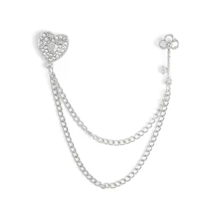 Elegant heart and key brooch with sparkling rhinestones and double silver chain link