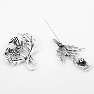 Detailed view of the antique silver Scottish thistle brooch showing front and back