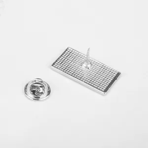 Detailed macro shot of the silver metal pin back and butterfly clutch closure accessory