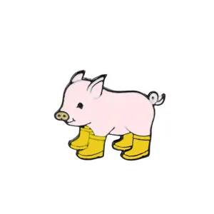 Detail shot of a cute pink pig enamel pin wearing bright yellow rain boots for denim jackets