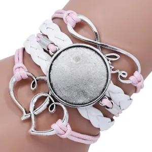 Close-up of handmade multi-layer braided bracelet base with heart and love charms