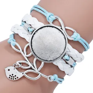 Detailed view of handmade multi-layer braided bracelet base with infinity and bird charm