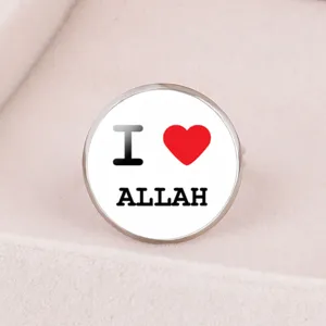 Macro detail of a time gem open ring featuring 'I love Allah' with a red heart design