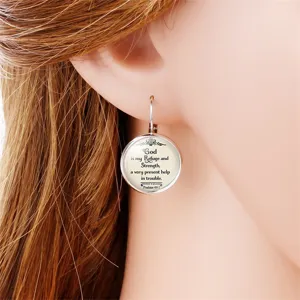 Detailed close-up showing a silver round lever-back earring with Psalms 46:1 Bible verse