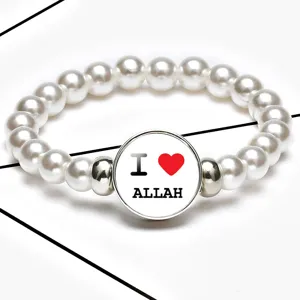 Detailed view of white pearl stretch bracelet featuring an 'I Love Allah' glass cabochon center