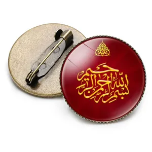 Vintage bronze circular brooch with red glass dome and gold Arabic calligraphy