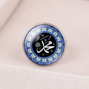 Detailed close-up of Middle Eastern Islamic calligraphy ring featuring blue mosaic art