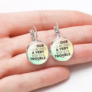 Close-up of lever-back earrings with Psalm 46:1 Bible quote on gradient background