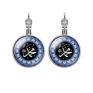 Silver lever-back earrings featuring Arabic calligraphy under a blue glass cabochon