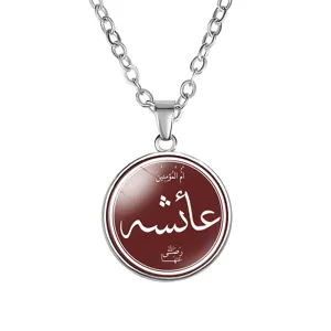 Detailed macro view of silver necklace with Arabic Aisha calligraphy on dark red pendant