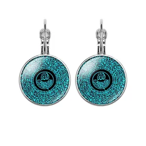 Close-up of Islamic Allah calligraphy glass cabochon leverback earrings in silver-tone