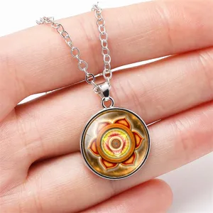 Close-up of 18mm yoga chakra mandala pendant on silver chain necklace