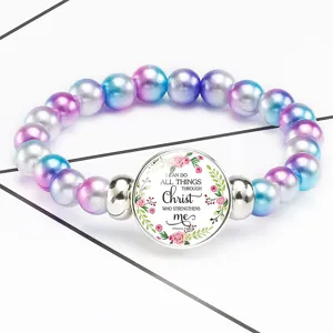 Detailed macro view of Philippians 4:13 Bible verse on colorful beaded stretch bracelet