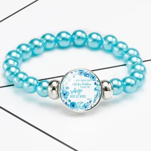 Macro shot of a blue beaded stretch bracelet featuring a biblical Psalm 91:4 quote