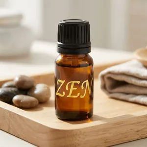 Gros plan d'un autocollant lettre ZEN doré sur un flacon d'aromathérapie ambré