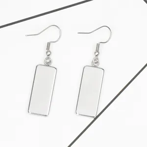 Detailed view of silver stainless steel rectangular drop earrings with fish hook base