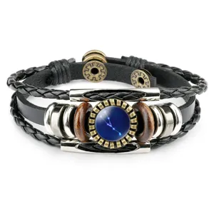 Detailed view of vintage multilayer leather bracelet with blue Taurus constellation glass gem