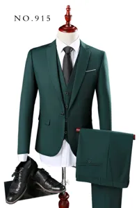 Detailed view of elegant dark green three-piece slim fit men's formal suit on mannequin