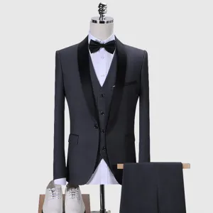 Detailed view of grey men's three-piece suit with black shawl collar on a mannequin