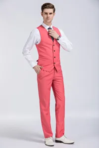 Detail shot of a coral pink men's slim fit suit vest and matching dress pants