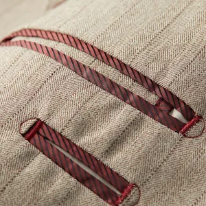Close-up of slim fit light coffee striped men's suit jacket herringbone texture