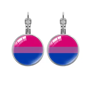 Close-up of French hook earrings with bisexual pride flag pattern under glass