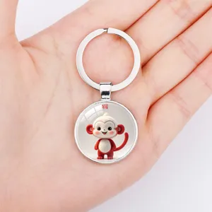 Primer plano de un lindo llavero del zodiaco mono con anillo de metal y cristal
