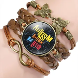 Detail of braided leather autism awareness bracelet with different not less charm