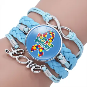 Handmade blue braided autism awareness bracelet with puzzle ribbon and Love charm