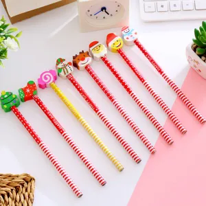 Detail of assorted Christmas-themed pencils featuring festive cartoon character erasers