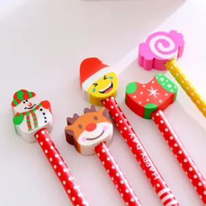 Detailed macro view of festive Christmas pencils featuring colorful snowman and reindeer erasers
