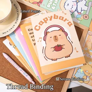 Close-up of cute Capybara cartoon notebooks with lined pages and sewn binding detail.