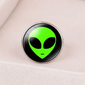 Close-up detail showing the green alien icon on an adjustable time gem ring band.