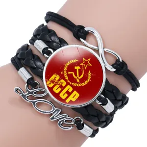 Multi-layer leather bracelet with vintage USSR CCCP glass dome charm and metal love pendant.