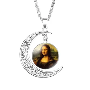 Intricate silver crescent moon necklace featuring a classic Mona Lisa glass gem pendant.