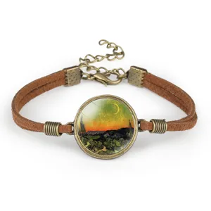 Detail of brown velvet cord bracelet with Van Gogh landscape art glass cabochon