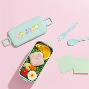 Large 3-inch colorful alphabet stickers ALICE applied on a mint green bento box lid