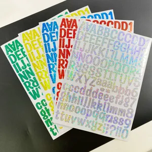 Detailed view of colorful holographic glitter alphabet and number sticker sheets