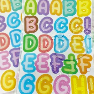 Macro view of waterproof colorful English alphabet stickers showing water resistance
