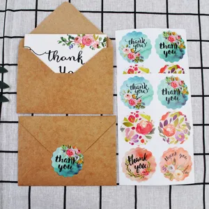Detailed view of vintage kraft envelopes with floral thank you card and stickers set