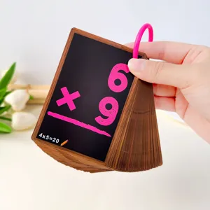 Close-up view of educational math mental calculation flashcards with pink numbers and ring binder