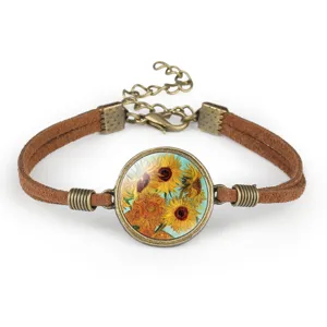 Detail view of Van Gogh sunflower painting glass cabochon bracelet with brown cord