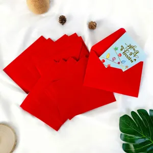 Set of festive red Christmas envelopes featuring a card with Merry and Bright design