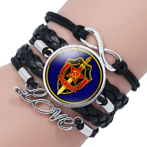 Multi-layer black leather braided bracelet featuring KGB USSR glass cabochon charm.