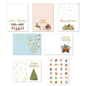 Detailed view of the Christmas greeting card set featuring assorted gold foil designs and stickers