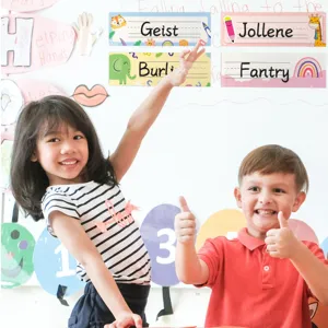 Colorful student desk name plates for classroom decoration shown with two happy children