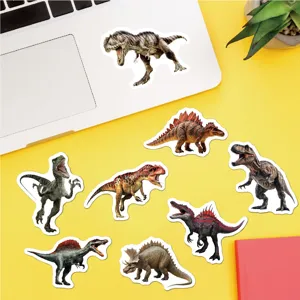 Realistic dinosaur stickers on a yellow desk next to a white laptop and plant.