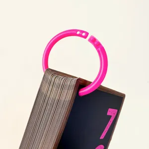 Close-up detail of math flashcards with pink ring binder for early education kids