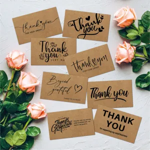 Set of eight diverse kraft paper thank you cards for gift packaging with pink roses