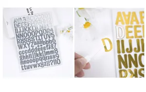 Macro view showing a gold letter D sticker being peeled for DIY journal decoration